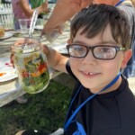 Photos from 5/21/24 CCCS visit to New Roots. The children made salads in a jar with vegetables harvested from the garden.